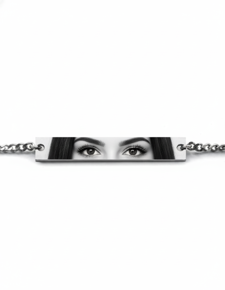 a mockup of a silver bracelet featuring a woman's eyes
