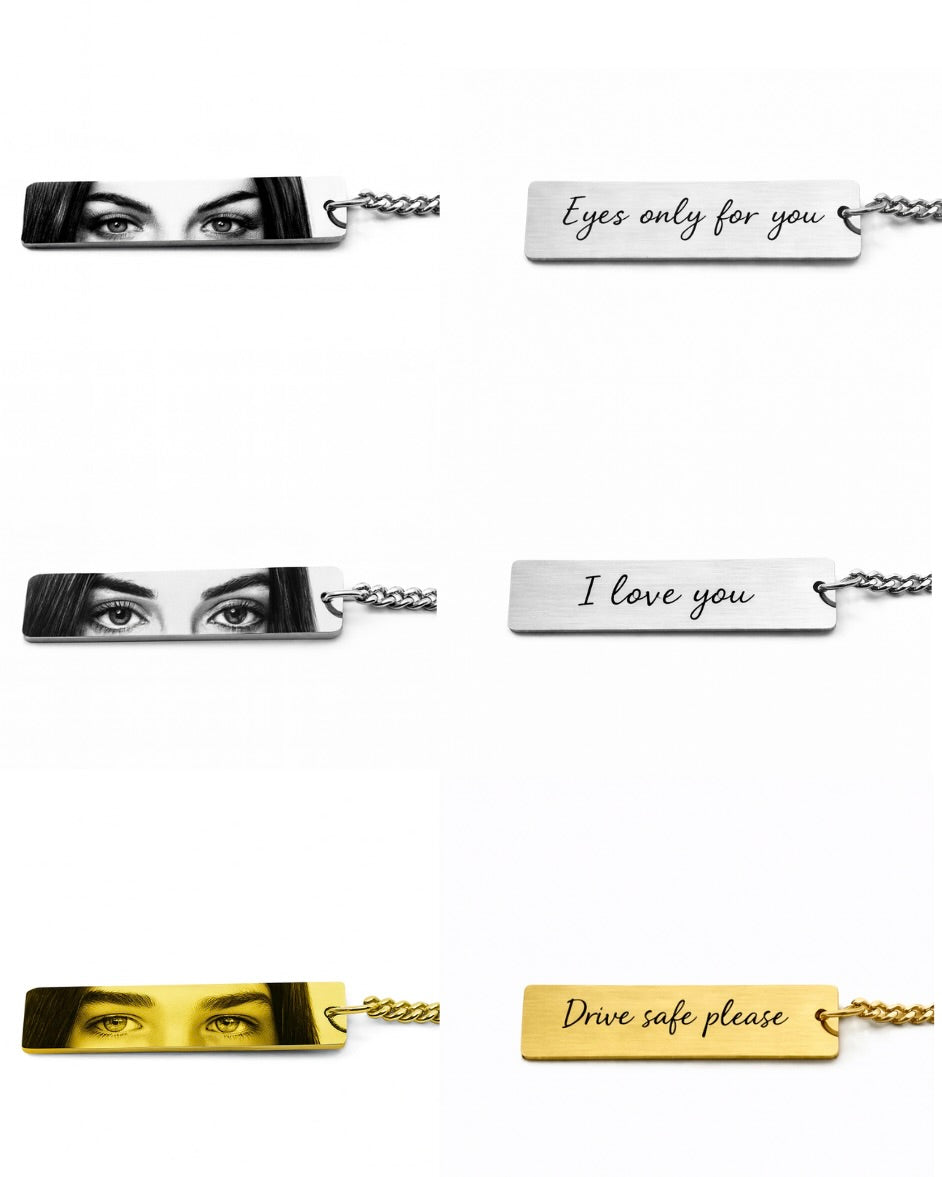 two silver keychains and one gold keychain with eyes on the front and custom text on the back