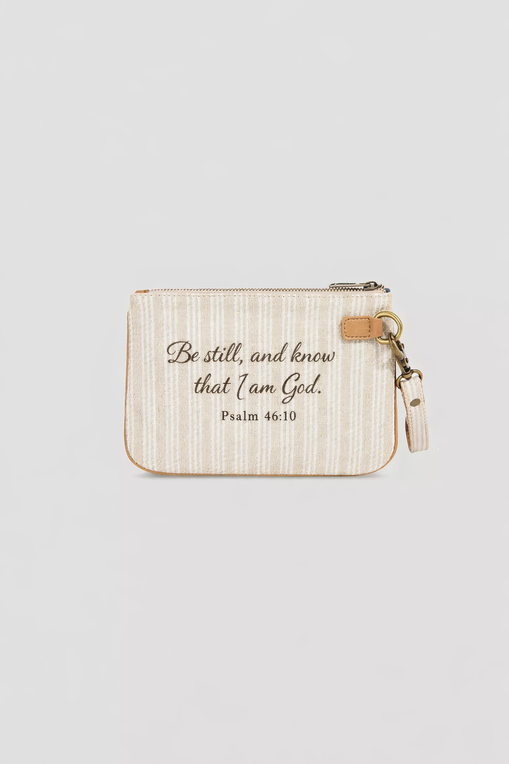 a cream-and-beige-patterned coin purse featuring a bible verse that reads "Be still, and know that I am God. Psalm 46:10" the customer has the option to choose any bible verse that speaks to them