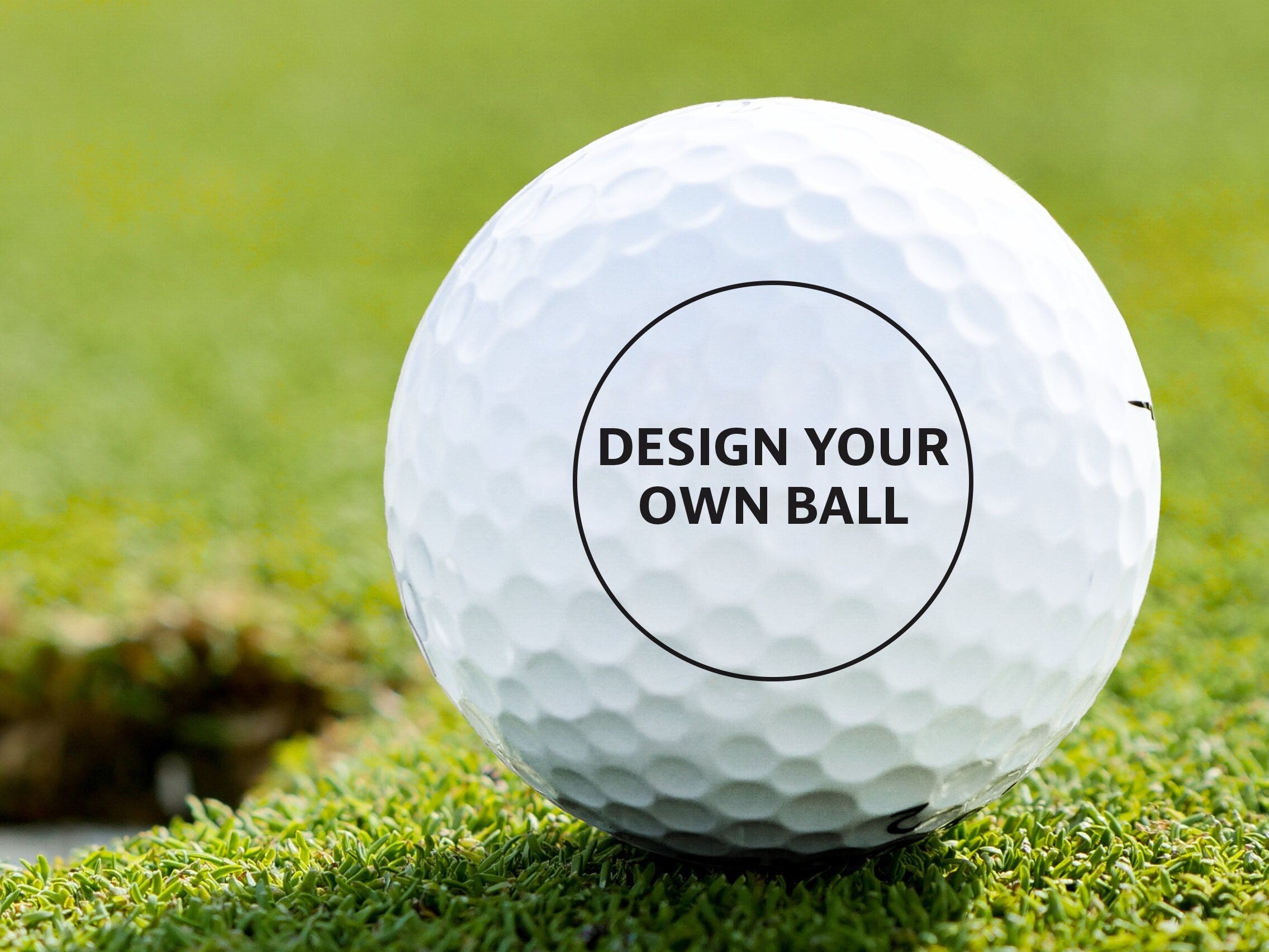a golf ball with the text "design your own ball"