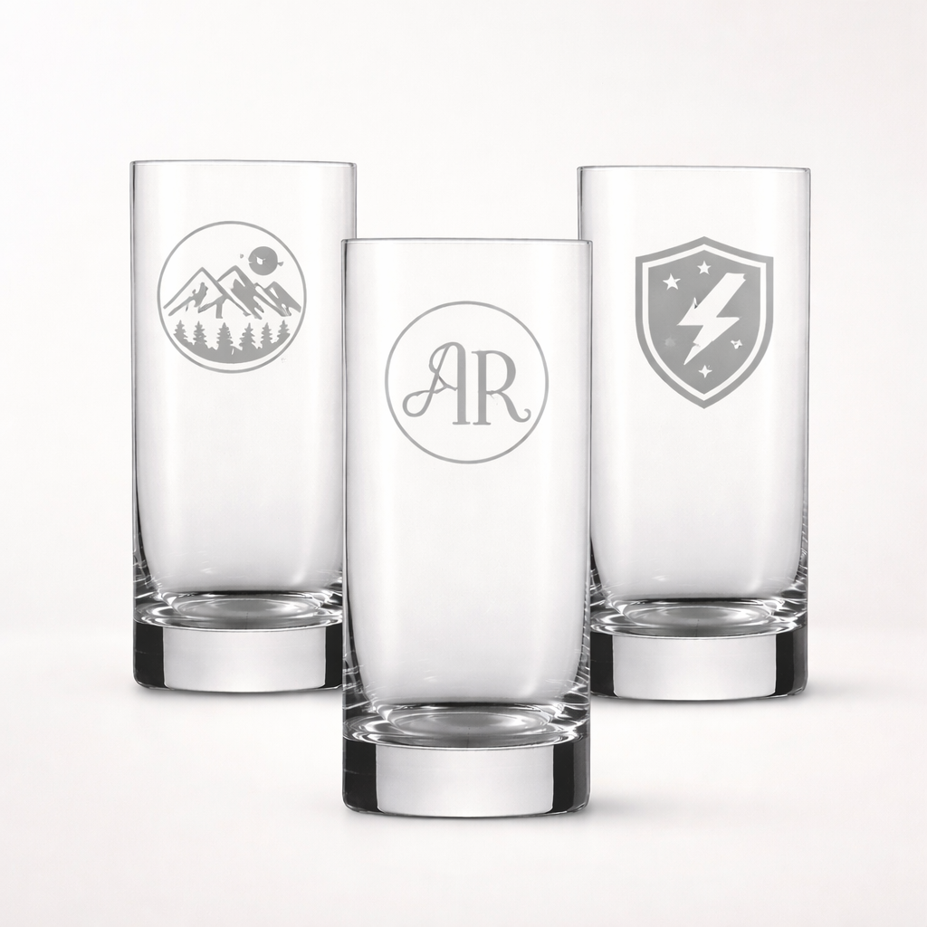 three glass cups with photo engravings on them