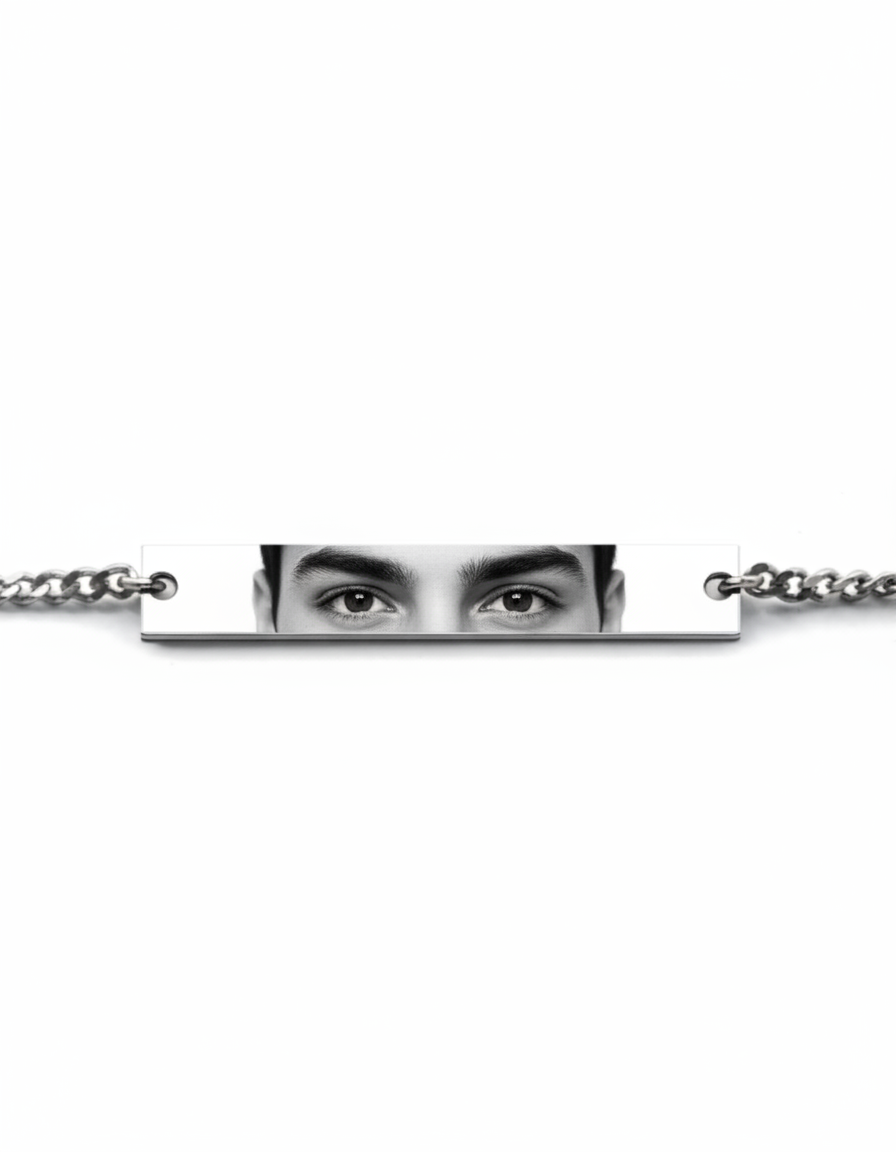 a mockup of a silver bracelet featuring a man's eyes