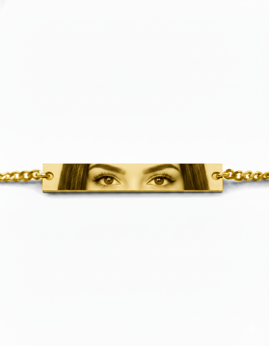a mockup of a bracelet featuring a woman's eyes, in gold