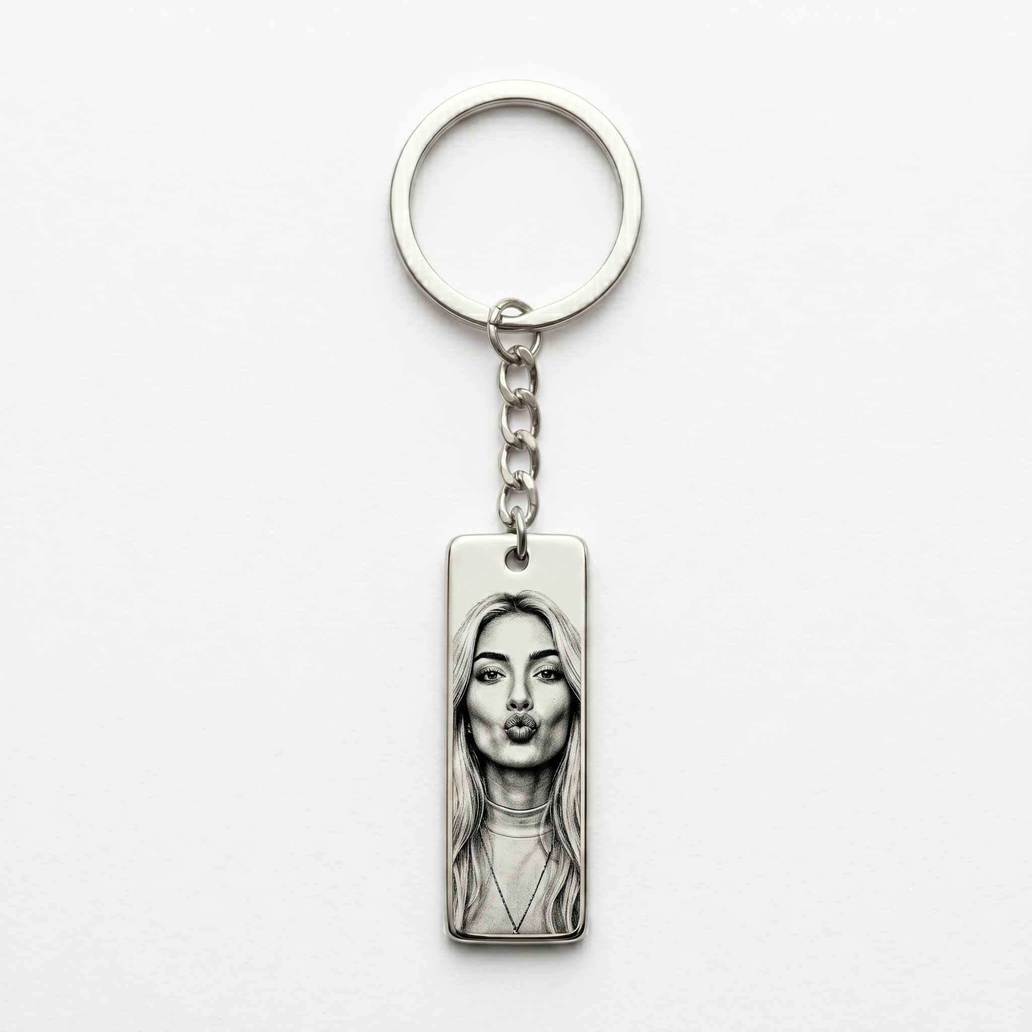 vertical keychain pendant featuring the printed image of a woman making a "kissy face"