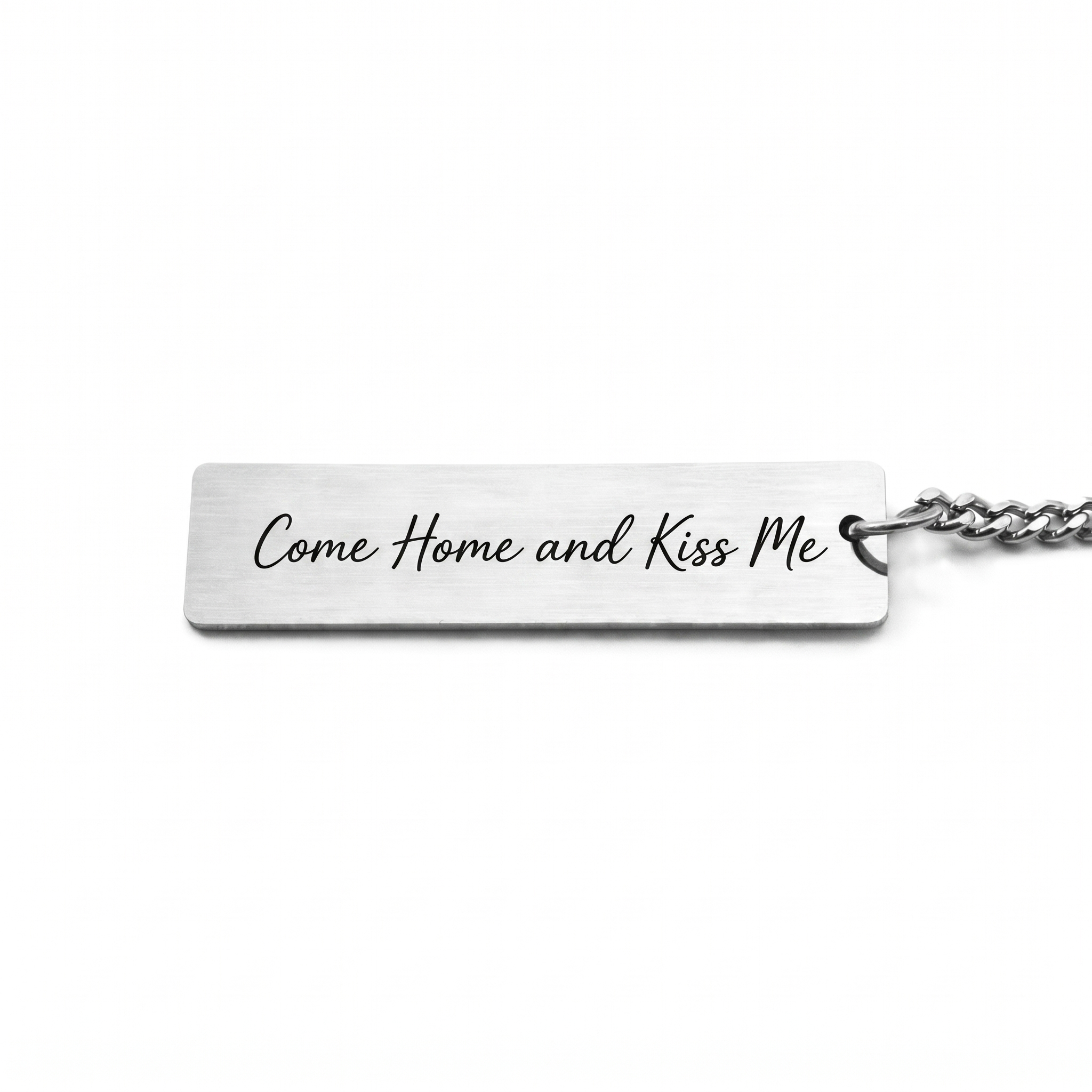 custom text on the back of a keychain in a casual script font that reads "come home and kiss me"