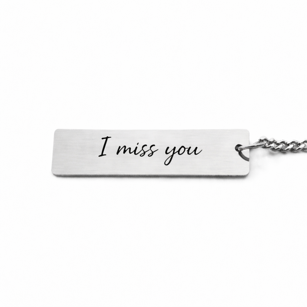 back of an eternal eyes pets keychain showing custom text "i miss you"