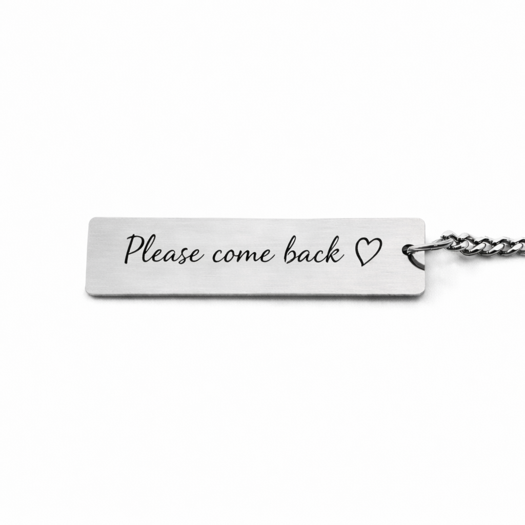 back of an eternal eyes pets keychain with custom text "please come back"