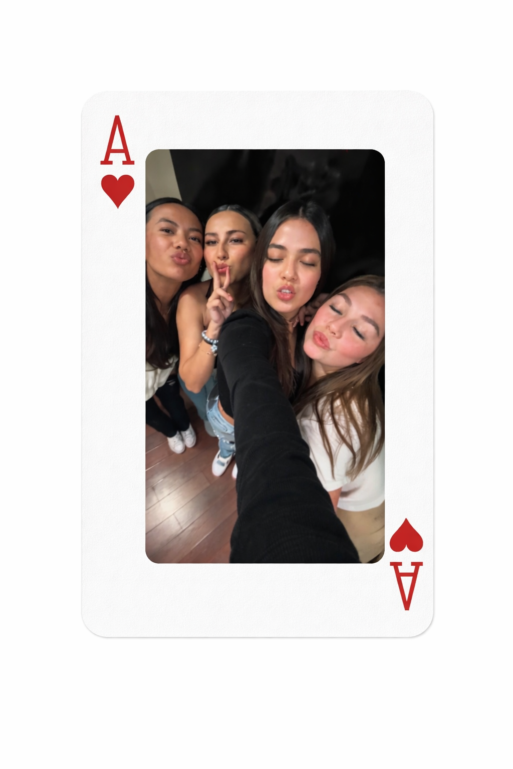 an ace of hearts playing card with the face being a photo of four girls making silly faces at the camera